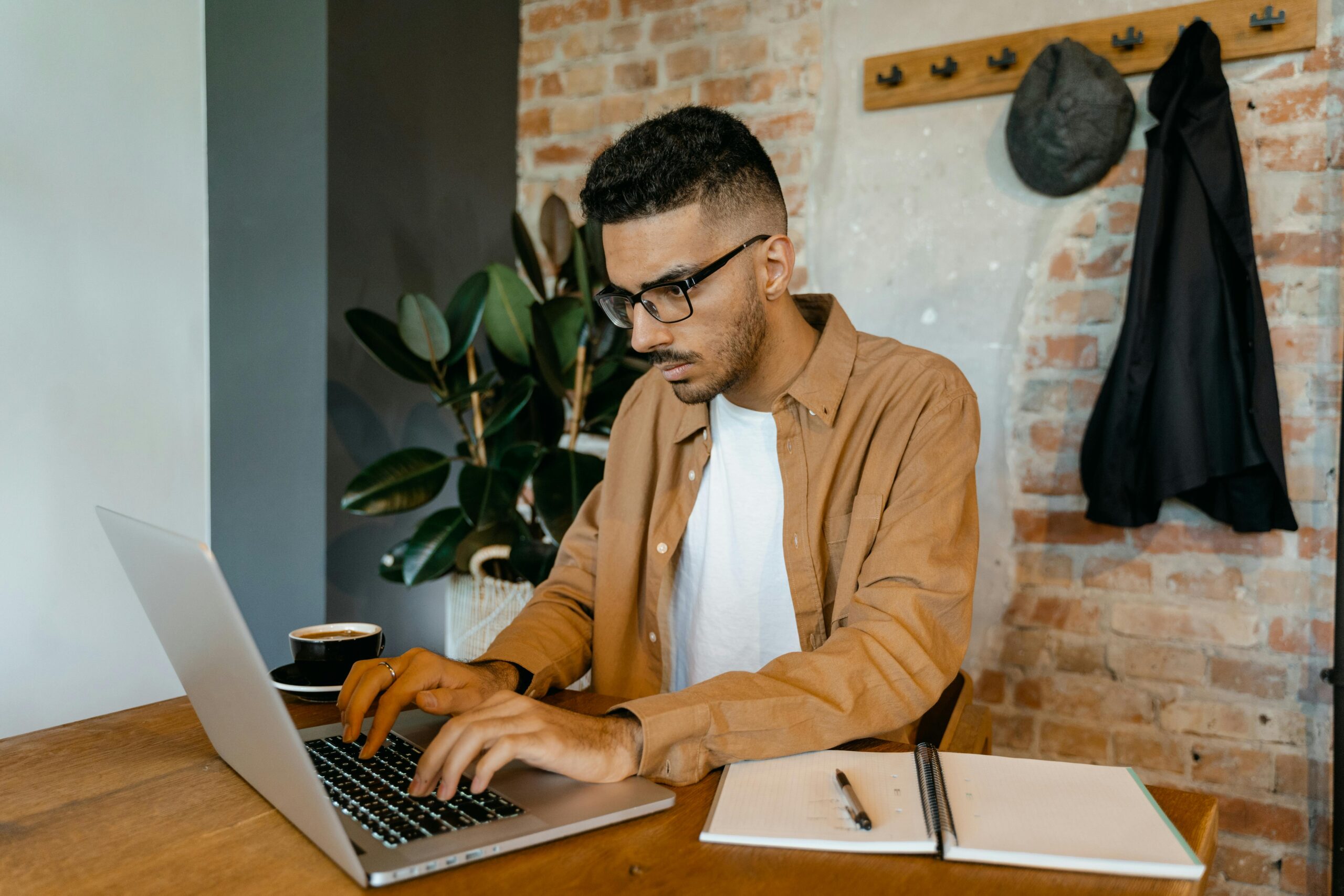 Beginner working online from home using a laptop